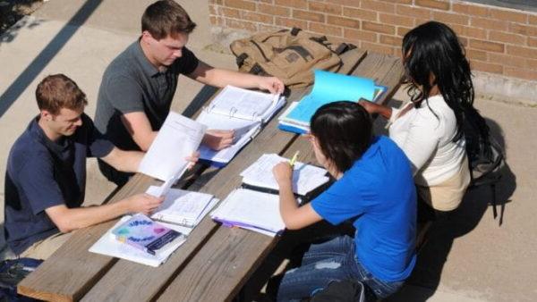 a group of people studying at a table